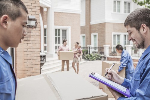 Professional movers handling household items