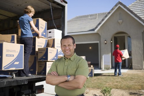 Organized office items being packed by experts